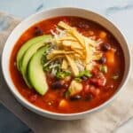 Chicken Tortilla Soup with Avocado, Cheese, and Crispy Tortilla Chips Recipe