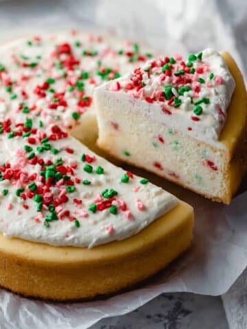 Sugar Cookie Cheesecake with Sprinkles and Sour Cream Frosting Recipe