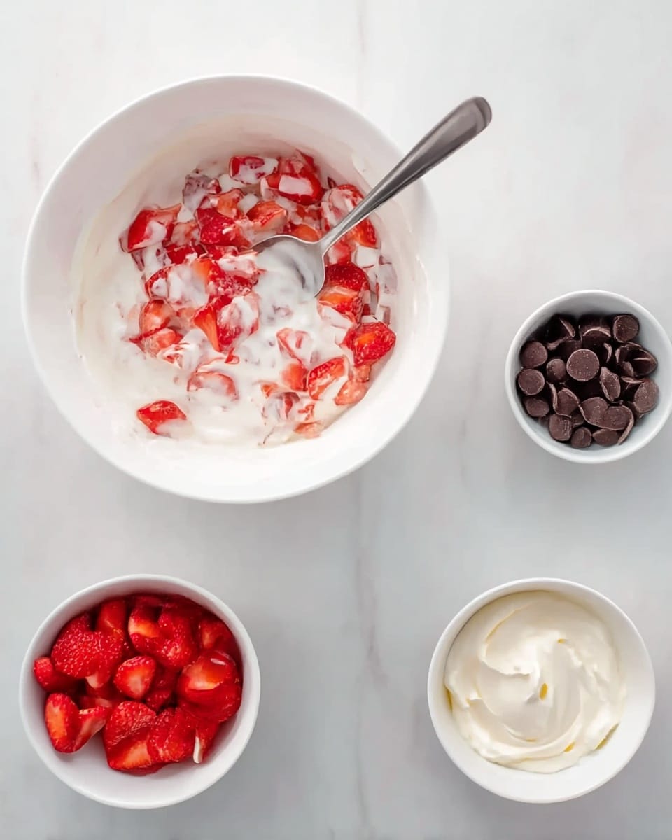 A round wooden tray holds several small white bowls and clear glass containers arranged neatly on a white marbled surface. One large clear measuring cup filled with white milk is placed at the top right. Below and slightly to the left is a small white bowl filled with white sugar. Beneath that, a round glass bowl contains crumbled dark brown unsweetened cocoa powder. To the left, a small black bowl holds white all-purpose flour with a smaller black bowl above it containing a sprinkle of white salt. At the top left, a small white bowl with dark brown vanilla extract sits near the center, with a tiny spot of yellow butter on the tray between the measuring cup and the bowls. The arrangement is clean and simple. photo taken with an iphone --ar 4:5 --v 7