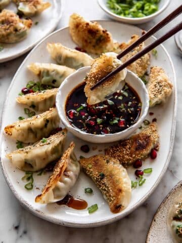 Ginger Sesame Chicken Potstickers with Sweet Chili Pomegranate Sauce Recipe