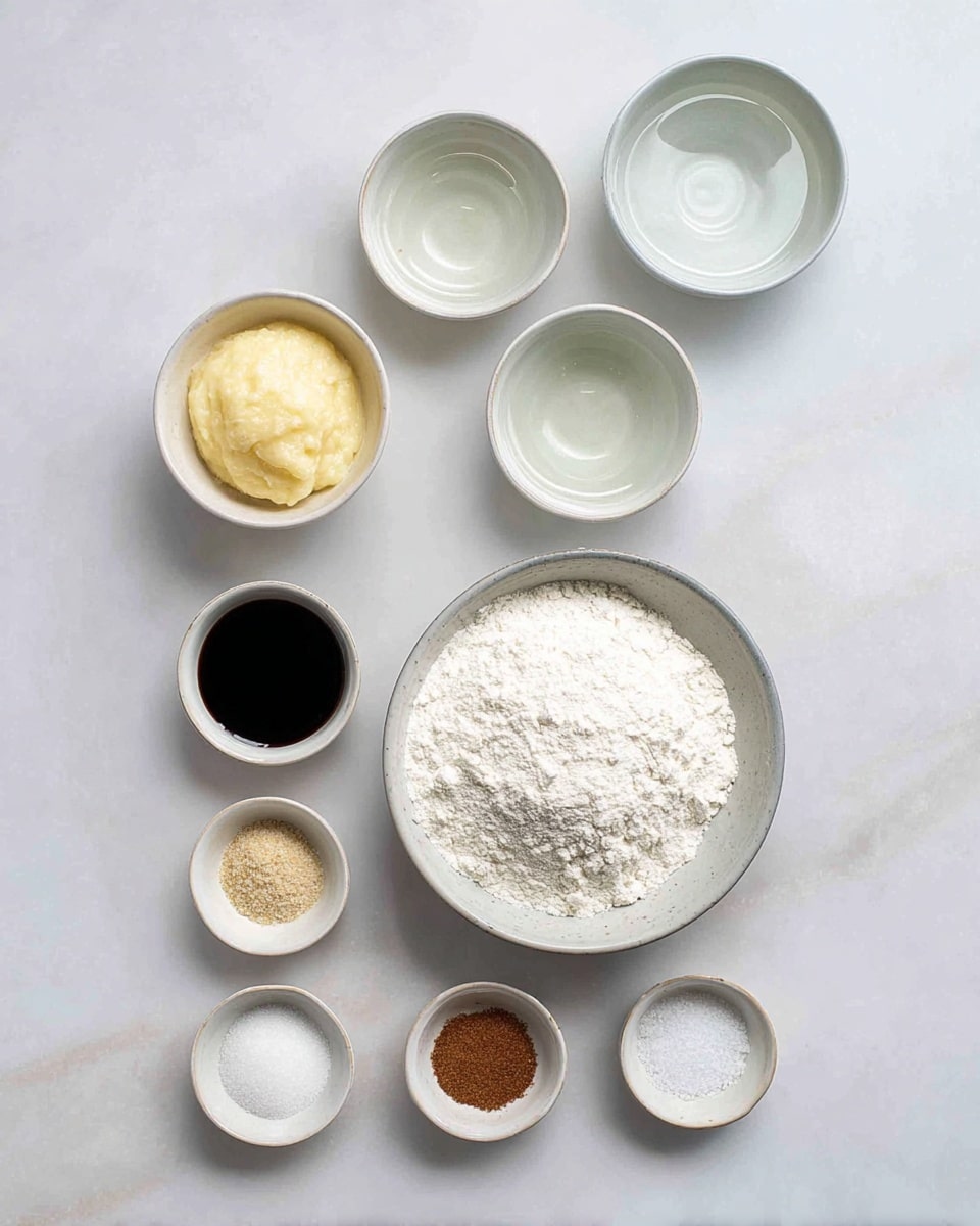 The image shows nine small bowls arranged neatly on a white marbled surface. In the center is a larger white bowl filled with white flour. Above it, there are two medium white bowls, each containing a clear liquid. To the left, there is a small white bowl holding a thick, pale yellow paste, and below it, a small white bowl with a dark brown liquid. To the right of the large bowl, there is a small white bowl filled with granulated white sugar. Along the bottom, four tiny white bowls are lined up, each with a different powder: light brown, white, brown, and white, all neatly placed and contrasting gently with the smooth white marbled surface photo taken with an iphone --ar 4:5 --v 7