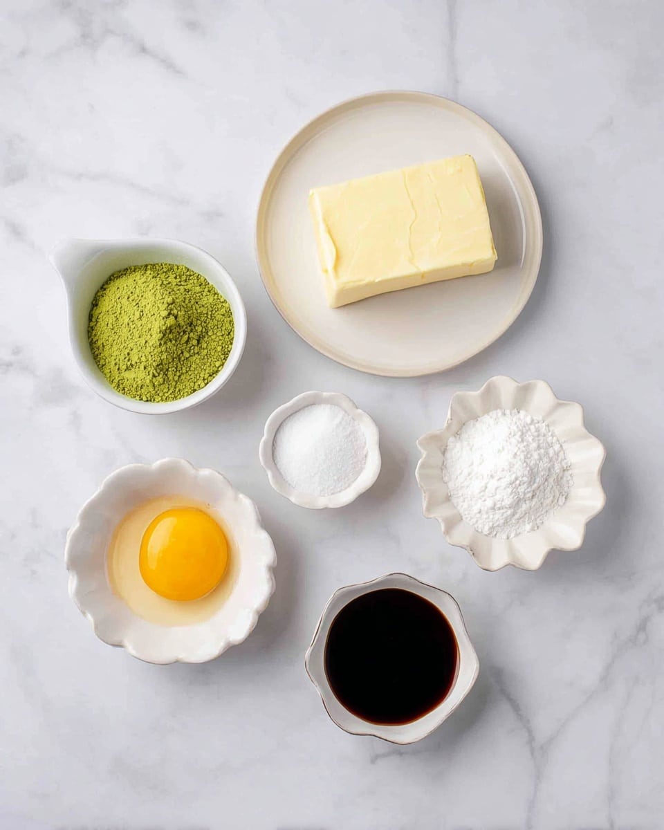 The image shows six small white dishes arranged on a white marbled surface, each holding a different baking ingredient. From left to right, there is a small white cup with bright green powder, a white plate with a rectangular block of yellow butter, a round white bowl filled with white sugar, another round white bowl with a yellow egg yolk, a tiny white bowl with dark brown liquid, and a small white flower-shaped dish containing white powder. The colors vary from green, yellow, white, to dark brown, with textures ranging from powdery to smooth and creamy. Photo taken with an iphone --ar 4:5 --v 7