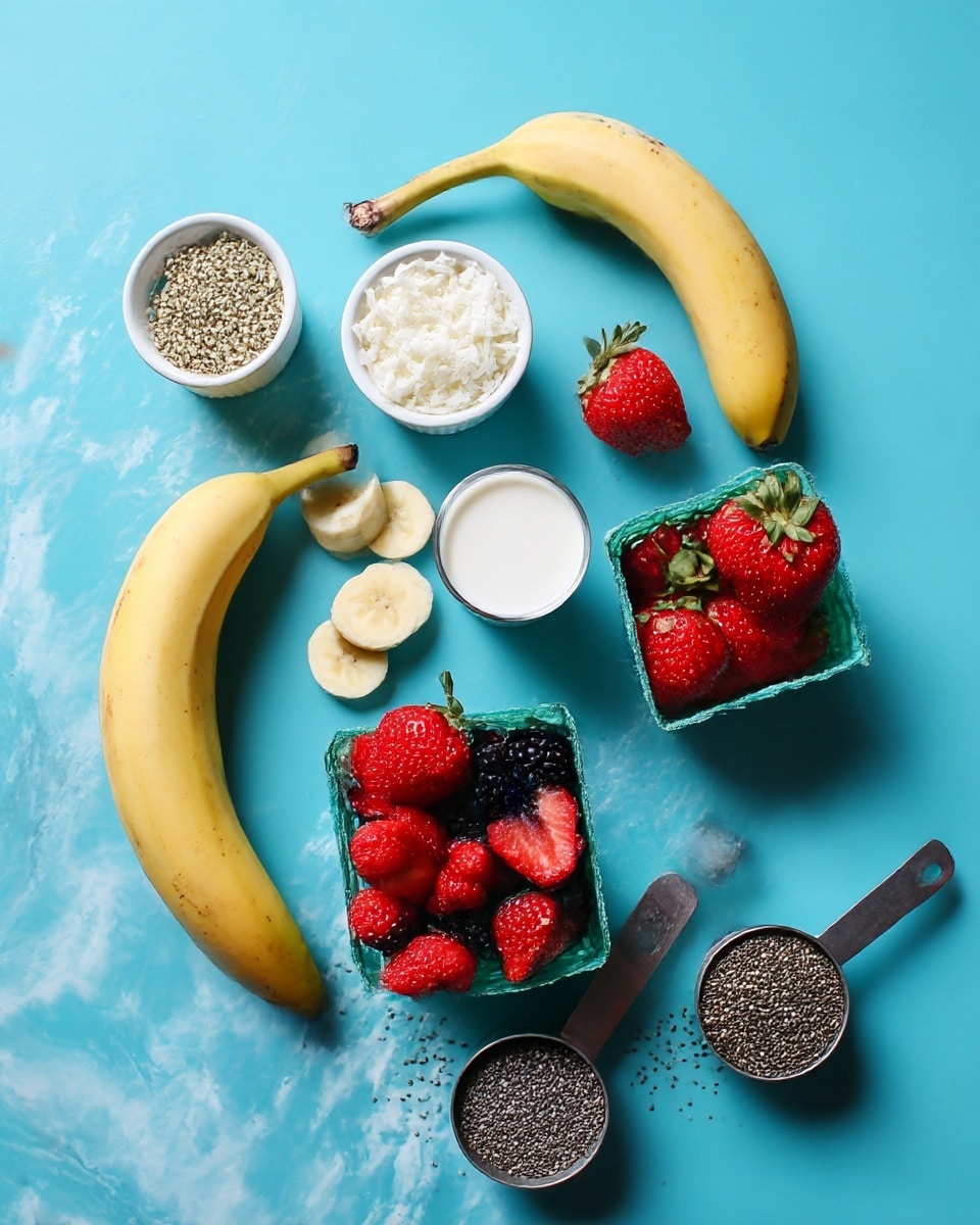 The image shows a simple arrangement of fresh fruit and seeds on a bright blue surface with a white marbled texture. Two whole yellow bananas are placed on the left side, with a small white cup of round banana slices nearby. Above the bananas, there is a small white cup filled with shredded coconut flakes. Around the middle, a small white cup holds white coconut milk. On the right side, a green transparent basket is full of bright red strawberries with leafy tops, with some strawberry slices lying beside it. Above that, a small gray container is filled with mixed frozen berries including blackberries and raspberries. Below, two gray scoops hold small black chia seeds and larger light green hemp seeds, scattered slightly outside their containers. The colors and textures are clear and fresh. Photo taken with an iphone --ar 4:5 --v 7