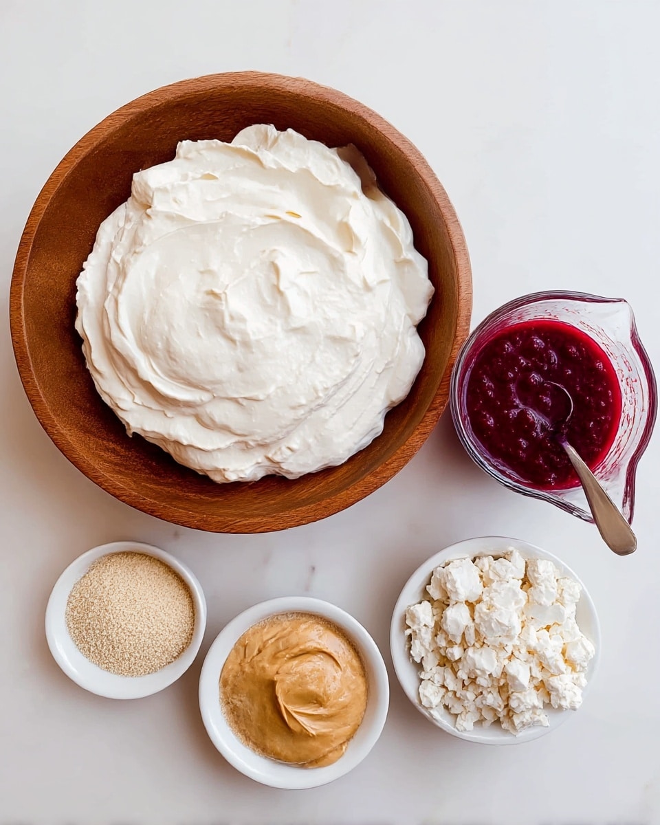 A large wooden bowl holds a thick, smooth white cream with soft, rounded peaks forming a gentle, cloud-like texture. To the right of the bowl is a clear measuring cup filled with a deep red, slightly chunky sauce or puree, with a spoon resting inside. Below these, three small white bowls are arranged in a loose cluster: one has a golden-brown creamy paste with a glossy surface, another is filled with a light beige powdery substance, and the last one contains crumbly white chunks with a coarse texture. All items rest on a white marbled surface. photo taken with an iphone --ar 4:5 --v 7