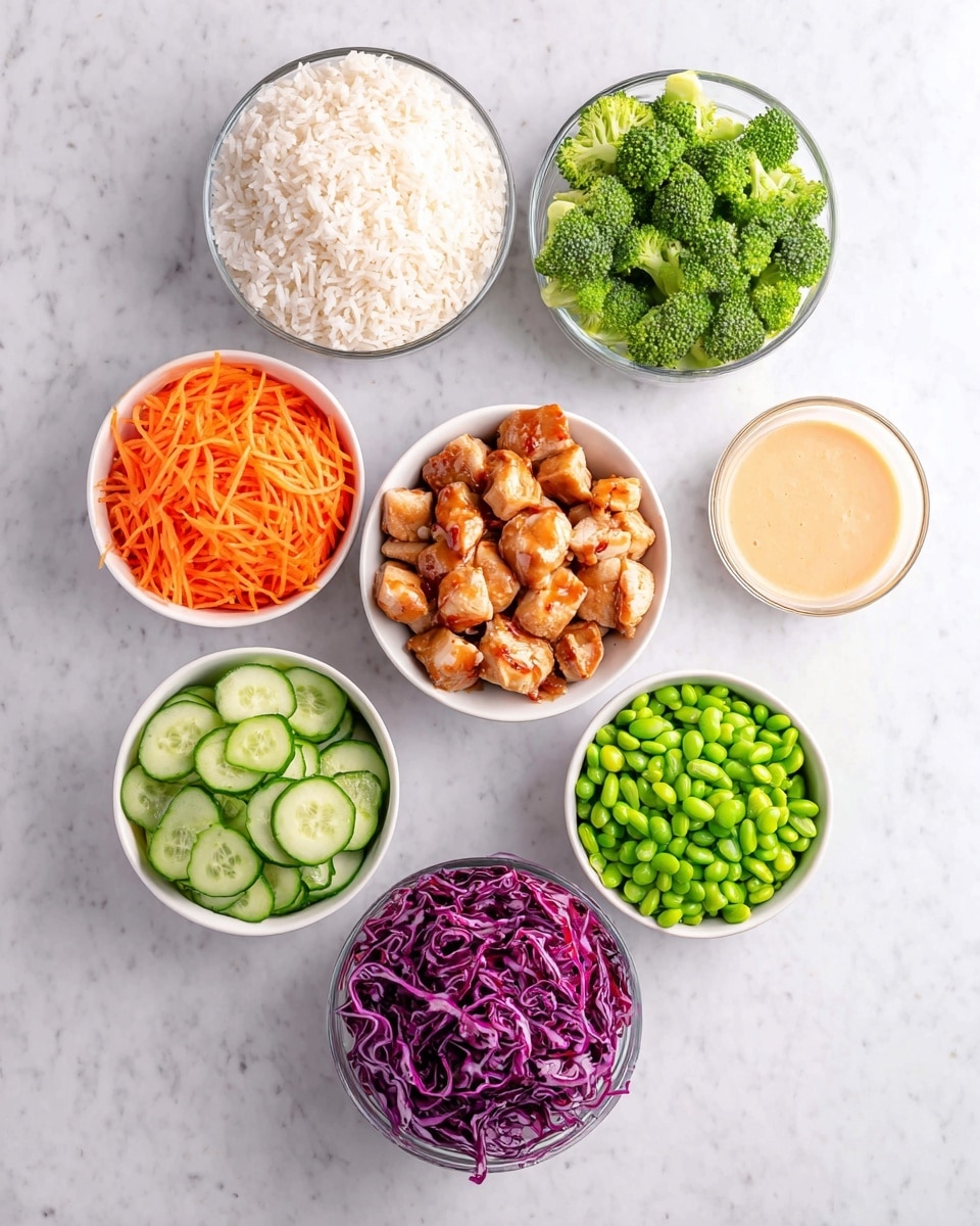 The image shows eight small white bowls arranged on a white marbled surface. Each bowl contains a different food item: one bowl is filled with plain white rice with a fluffy texture; another has bright green broccoli florets that look fresh; a third bowl contains shredded orange carrots with a thin and stringy texture; a fourth bowl holds small green edamame beans; the fifth bowl is filled with thinly sliced green cucumber rounds, each showing seeds inside; the sixth bowl contains finely chopped green onions; the seventh has shredded purple cabbage with curly thin strips; and the central bowl holds browned bite-sized pieces of cooked chicken drizzled with a beige sauce. There is also a small bowl with a creamy light orange sauce beside the rice. The colors of the ingredients are vibrant and fresh. photo taken with an iphone --ar 4:5 --v 7