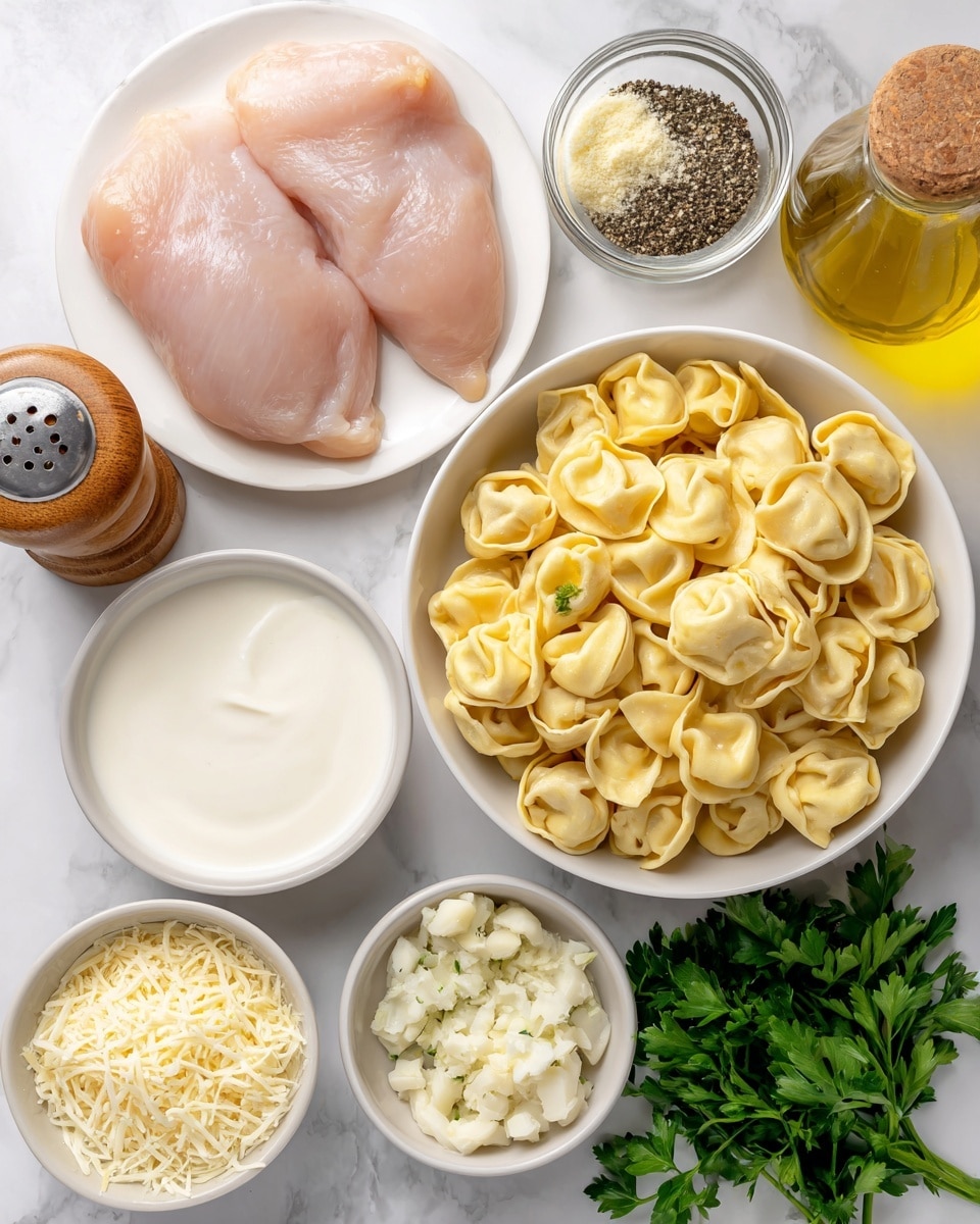 A white plate holds two raw chicken fillets with a pale pink color on the top left. In the center, a white bowl is filled with yellow cheese tortellini, each piece shaped like small folded bundles. To the bottom left is a small white bowl with heavy cream, showing a smooth, white liquid. Near the tortellini, there is a smaller white bowl filled with grated parmesan cheese, pale yellow with a fine texture. Fresh green Italian parsley lies to the right side with its leafy texture. Above the parsley, a small white bowl contains minced garlic with a slightly wet, crumbly texture, and next to it another small white bowl has light beige garlic powder in a fine, powdery form. There is a clear glass bottle of golden olive oil and a pepper grinder filled with black peppercorns next to a small wooden container with white salt. The background surface is a white marbled texture. Photo taken with an iphone --ar 4:5 --v 7