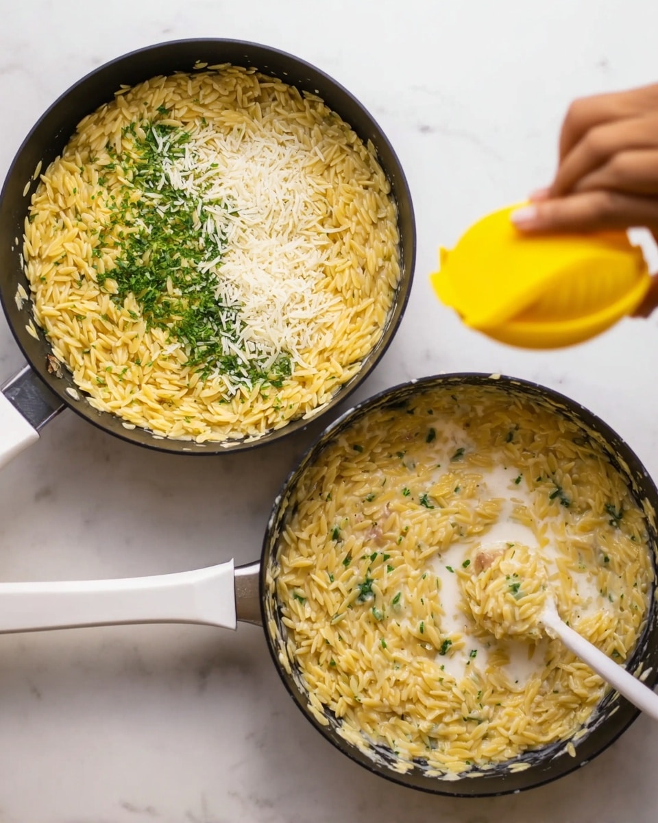 The image shows two black pans with orzo pasta being cooked. The first pan contains layers of yellow orzo pasta, white milk, green chopped herbs, and white grated cheese placed on top in small piles on a white marbled surface. The second pan shows the orzo pasta mixture being stirred by a white spatula, while a woman's hand holds a bright yellow lemon squeezer above the pan, squeezing juice onto the pasta. The orzo looks creamy with visible bits of green herbs mixed throughout. Photo taken with an iphone --ar 4:5 --v 7