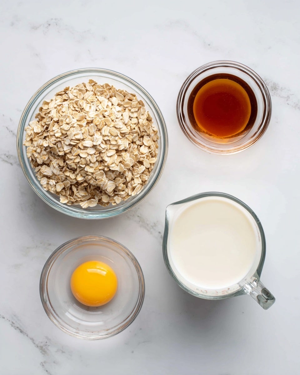 The image shows four clear glass containers placed on a white marbled surface, each holding a different ingredient. The largest bowl in the middle contains light brown rolled oats with a rough texture. To its left, a smaller bowl holds a bright yellow raw egg with a smooth, shiny surface, and above it is an even smaller bowl filled with dark amber maple syrup, glossy and thick. To the right of the oats bowl, there is a clear measuring cup with white milk, smooth and liquid, visible through the glass. The overall look is clean and simple with a top-down view. Photo taken with an iphone --ar 4:5 --v 7