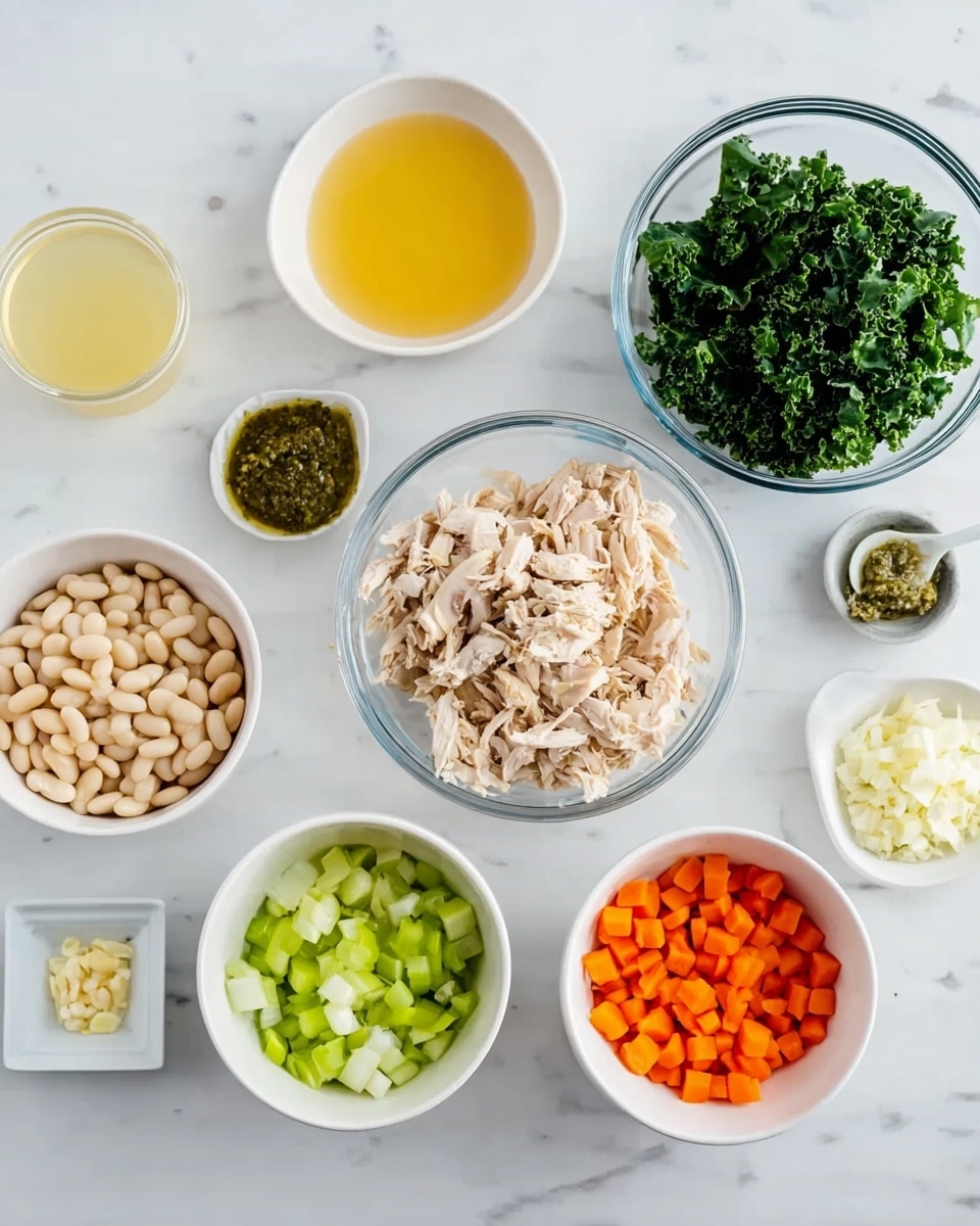 The image shows several clear and white bowls arranged on a white marbled surface, each filled with different ingredients. There is a clear bowl with shredded light beige chicken pieces positioned near the center, a clear bowl with deep green chopped kale to the right of the chicken, and a clear bowl with a light yellow liquid broth to the top left. Around the center are smaller white bowls containing finely chopped white onion, peeled white beans, finely diced bright orange carrots and light green celery placed side by side, a small white bowl with a green herb paste, a small glass shot glass filled with pale yellow lemon juice, and a very small white square dish with minced garlic. All the elements are evenly spaced and clearly shown, photo taken with an iphone --ar 4:5 --v 7