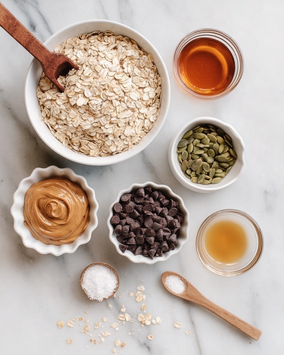 The image shows six small bowls and a wooden spoon on a white marbled surface. The largest bowl, white in color, is filled with light beige rolled oats with a wooden scoop placed on top. To the left, there is a white bowl with a swirl of creamy light brown peanut butter and a spoon inside it. Below the peanut butter is a white scalloped bowl filled with many small, dark brown chocolate chips, some scattered around the bowl. To the right of the oats, a small white bowl holds green pumpkin seeds. Below this is a small glass bowl with clear, amber-colored honey. Next to the honey is a tiny white bowl with a light golden liquid, likely vanilla or oil. In front, a small wooden spoon holds a white powder, probably salt. The layout is clean and organized with a soft, natural light. Photo taken with an iphone --ar 4:5 --v 7