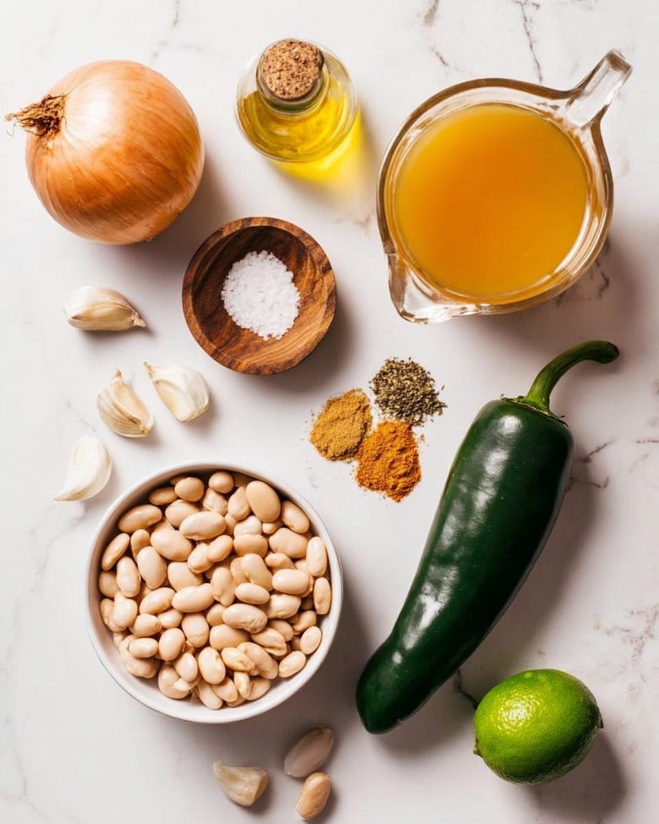 The image shows a top view of various fresh ingredients arranged neatly on a white marbled surface. In the center, there is a white bowl filled with light beige beans. To the upper right of the bowl is a clear glass pitcher filled with orange-yellow broth. Near the pitcher is a small clear bottle with light yellow oil inside. To the upper left of the beans, there is a whole light brown onion next to a small wooden bowl with white salt. Below the onion is a green jalapeño pepper. On the right side near the bottom, there is a large dark green poblano pepper. Below the poblano, there is a small white bowl with two piles of ground spices, one brown and the other yellowish. Next to the spices is a whole green lime. In the lower left corner, there are five light brown garlic cloves spread on the surface. The recipe setup looks clean and colorful with different textures and shapes. Photo taken with an iphone --ar 4:5 --v 7