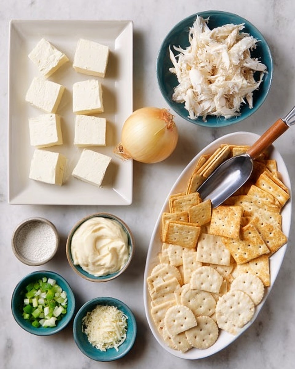 The image shows several small bowls and plates arranged neatly on a white marbled surface. On the left side, a white rectangular plate holds seven square pieces of white softened cheese. Above it, a white small bowl contains shredded white crab meat. A whole yellow onion is in the center. To the right of the onion, a metal scoop with a wooden handle holds a creamy white mayonnaise. On the right side, a large white oval plate is filled with different kinds of crackers, including round and rectangular shapes in light beige tones. Around the center bottom, there are small white bowls with finely chopped green onions, minced garlic, and a mix of salt and white granulated sugar. Another small white bowl with grated cheese is present. Photo taken with an iphone --ar 4:5 --v 7