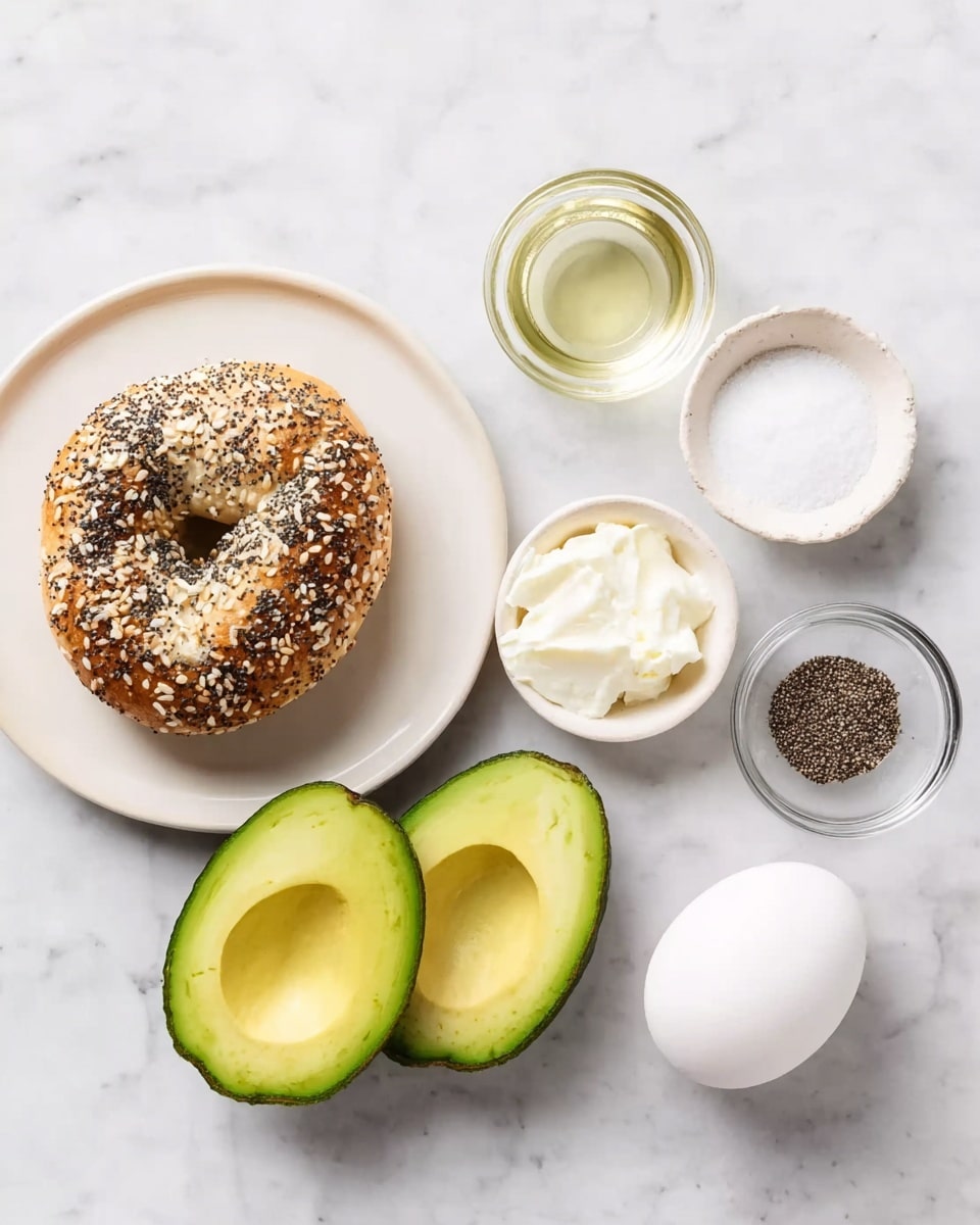 The image shows several ingredients neatly placed on a white marbled surface. On the left is a white plate holding a single everything bagel with various seeds on top. Below it are two halves of a ripe avocado with bright green flesh. To the right of the plate, there are four small bowls: one with a white creamy substance, one with clear liquid, one with black pepper, and one with salt. Next to the bowls is a whole white egg. The arrangement is simple and clean, with each ingredient clearly visible and spaced apart. Photo taken with an iphone --ar 4:5 --v 7