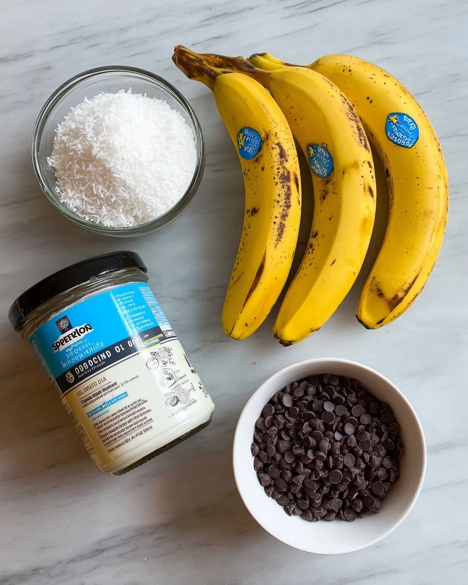 The image shows four objects arranged on a white marbled surface: at the top right, three yellow bananas with some brown spots and blue Chiquita stickers on their peel lie side by side, touching each other at an angle; to the top left, a clear glass container filled with white shredded coconut; below that, a tilted jar of Spectrum brand organic virgin coconut oil with a blue and white label and black lid; and to the bottom right, a white bowl filled with many small, round, dark chocolate chips. The items are evenly spaced and well lit, showing clear colors and textures. photo taken with an iphone --ar 4:5 --v 7