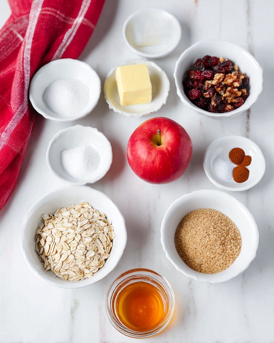 A group of small white bowls and one clear glass container are arranged on a white marbled surface. In the front is a white bowl filled with light beige rolled oats, to its right is another white bowl with light brown raw sugar. Above that bowl is a white bowl containing brown chopped nuts mixed with dark red dried fruit pieces. To the left of that bowl is a white bowl holding white salt, with another white bowl behind it containing a pale yellow square of butter. At the top right is a white bowl with small amounts of white, brown, and reddish-brown spices. A bright red apple sits on a white small plate near the center, and in front of it is a small clear glass container filled with golden honey. A red and white cloth is draped in the top left corner. Photo taken with an iphone --ar 4:5 --v 7
