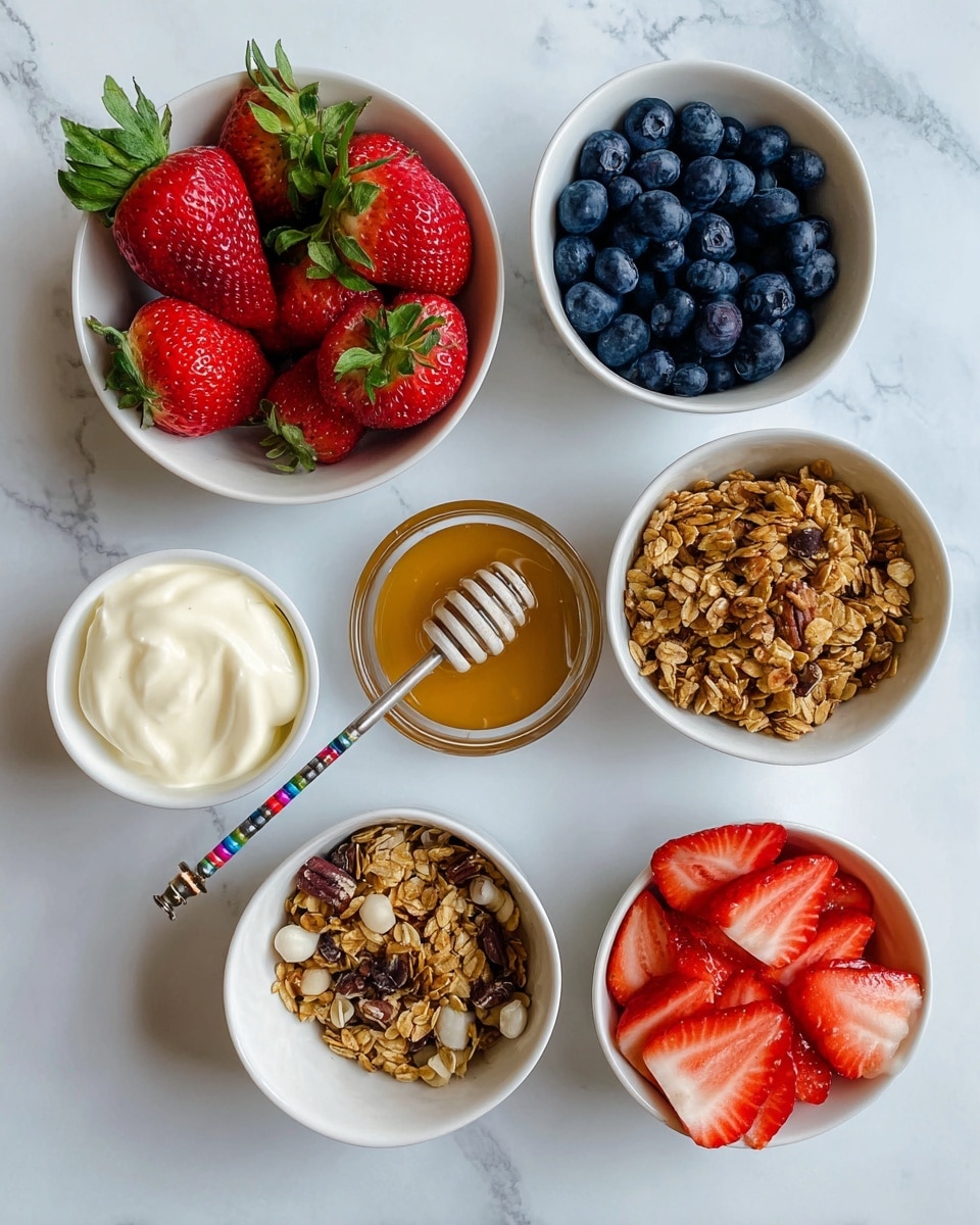 The image shows six small white bowls placed on a white marbled surface. The top left bowl contains fresh whole strawberries with green leaves, and above it is a bowl filled with dark blue blueberries. To the right, there is a small bowl of creamy pale yellow yogurt. Below the strawberries, a bowl is filled with golden brown granola mixed with nuts and seeds. In the center, there is a small bowl of clear honey with a silver honey dipper resting across it, which has a colorful handle. The bottom right bowl contains sliced strawberries, showing their bright red color and soft texture. The arrangement is neat and the colors are bright and natural photo taken with an iphone --ar 4:5 --v 7