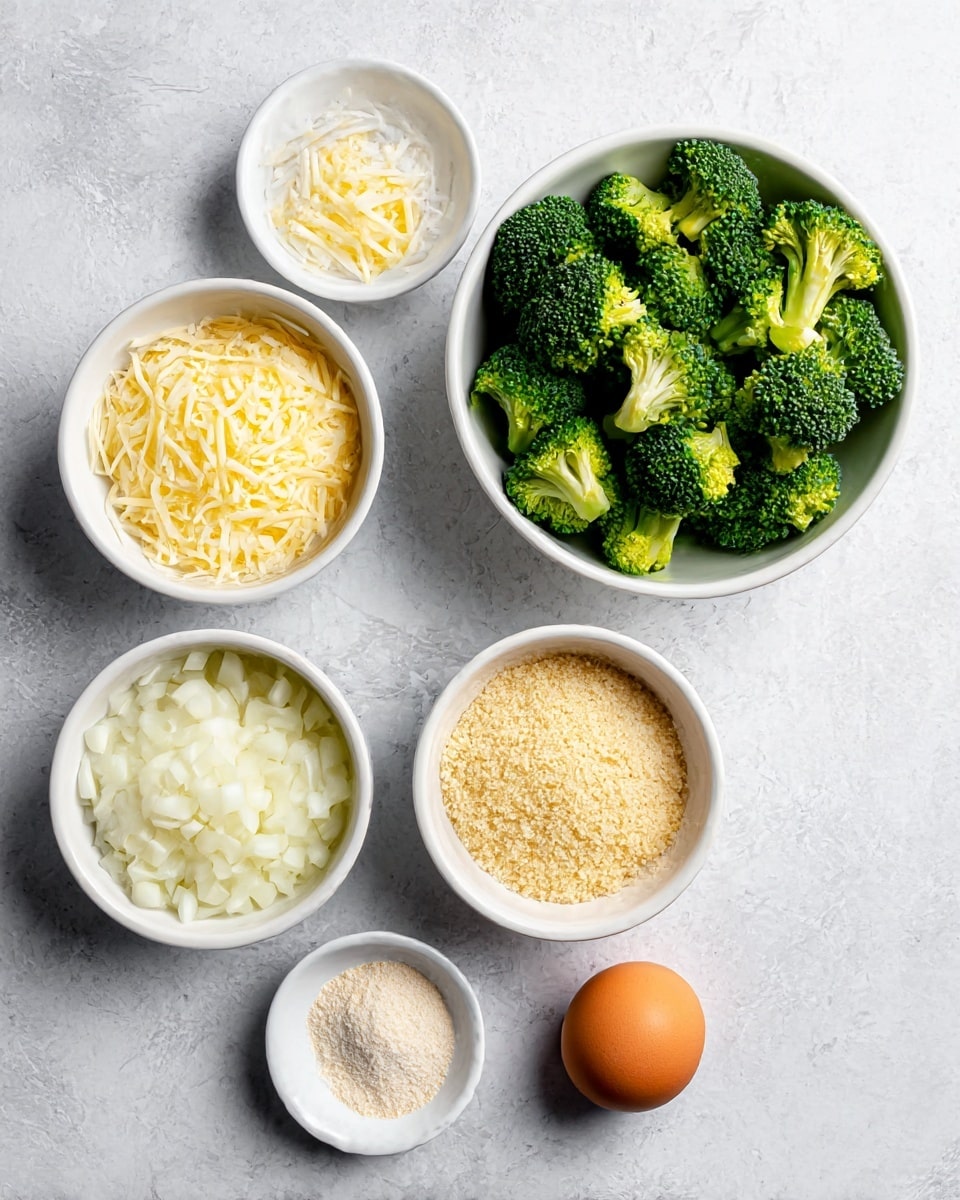 The image shows five ingredients arranged neatly on a white marbled surface. At the top right, there is a white bowl filled with fresh green broccoli florets with some yellow tips. To its left, another white bowl holds shredded pale yellow cheese. Below the broccoli, a white bowl contains light brown crumbly breadcrumbs. At the bottom left, a white bowl is filled with finely chopped white onions. A small white dish in the bottom center holds a small pile of light beige powder. To the right of all bowls, there is a single brown egg placed directly on the marbled surface. Photo taken with an iphone --ar 4:5 --v 7