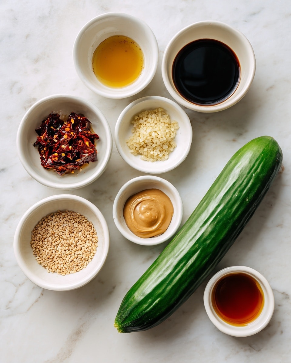 A long, fresh green cucumber lies horizontally on a white marbled surface. Around it are seven small white bowls arranged loosely in a circular shape. Each bowl contains a different ingredient: a dark brown soy sauce, a pale yellow rice vinegar, light tan runny peanut butter, dark red chili crisp with visible chili flakes, a small amount of grated garlic in off-white, light beige sesame seeds, and deep amber toasted sesame oil. Each bowl's content is smoothly textured, clearly visible against the white bowls and marbled background. The image is well-lit with natural light, showing clear, clean colors. Photo taken with an iphone --ar 4:5 --v 7
