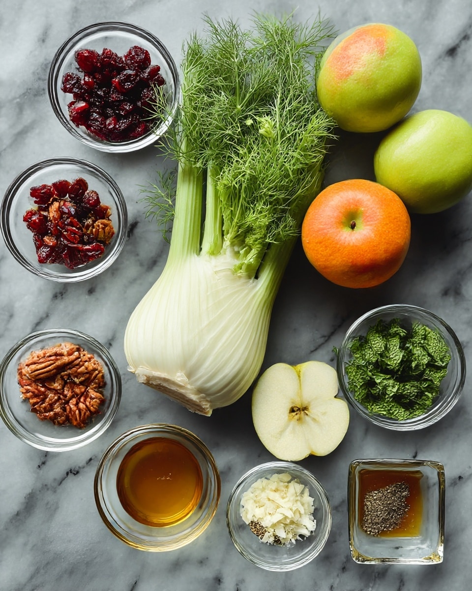 The image shows fresh ingredients neatly arranged on a white marbled surface. At the center, there is a whole fennel bulb with its white base and green feathery stalks spreading out. To the right of the fennel, three shiny green apples and one bright orange are placed close together. Around these main items, there are small clear glass bowls holding various ingredients: dark red dried cranberries, light brown candied pecans, thin white parmesan shavings, bright green chopped mint, golden olive oil, and light amber honey. Additionally, there is a small square glass dish with salt and black pepper, and another with apple cider vinegar at the bottom. The colors are mostly green, white, orange, and various shades of brown and gold, all set on the smooth white marbled surface. photo taken with an iphone --ar 4:5 --v 7