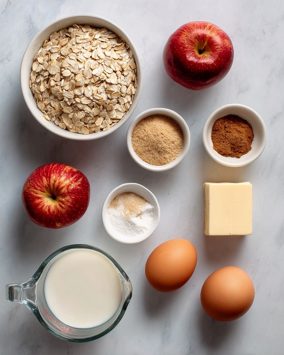 The image shows ingredients arranged on a white marbled surface with two red apples in the middle. To the left is a white bowl filled with light tan rolled oats, above which are small white bowls containing brown sugar, cinnamon, and baking powder. To the right of the apples is a stick of butter in its wrapper, next to two brown eggs placed side by side. Below the apples is a clear glass measuring cup filled with white milk. All items are spaced evenly, and the overall look is tidy and clear. Photo taken with an iphone --ar 4:5 --v 7