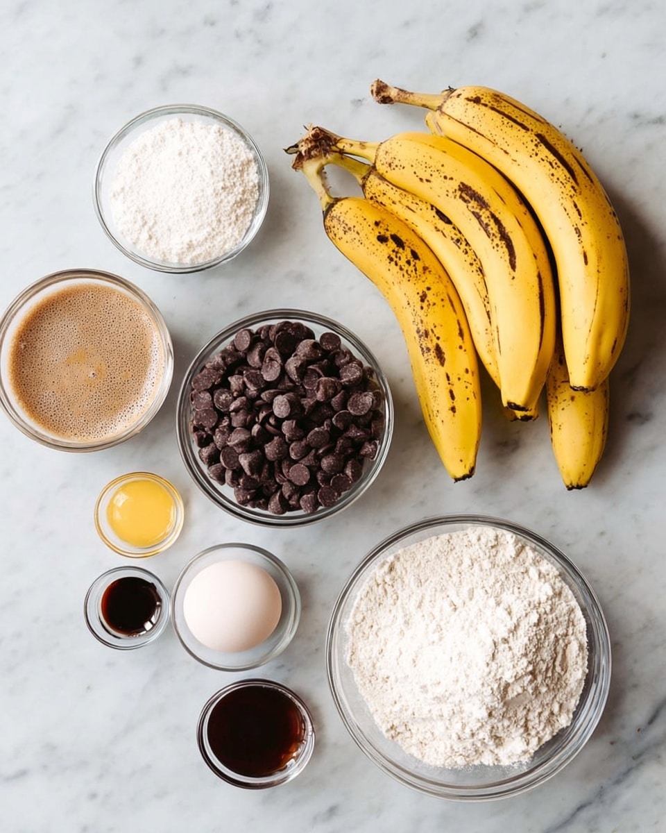 A white marbled surface holds several clear round glass bowls and a bunch of ripe yellow bananas with brown spots on the right. At the top left, there is a small bowl of white powder, next to a larger bowl filled with dark brown chocolate chips. Below them, a bowl of foamy brown liquid sits on the left. To its right, there is a small bowl of white powder, a small bowl of dark brown liquid, and a single raw egg in a clear bowl beneath them. Finally, there are two larger bowls at the bottom right filled with white flour and white sugar. Photo taken with an iphone --ar 4:5 --v 7